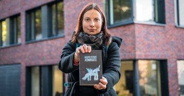 image of Hrinova holding a book